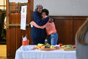 Ethical Culture Fieldston School Fieldston Upper student hugs a long time Fieldston alumni Janet